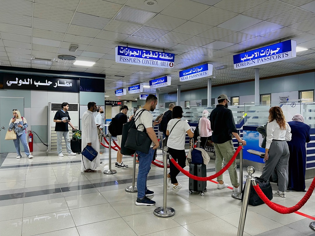 A Returning Citizen Pays $200 Fee for Phones at Aleppo Airport